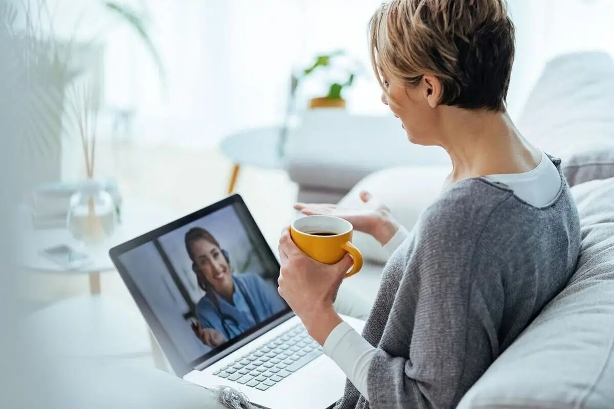Patient checking insurance cover online psychiatric care options.